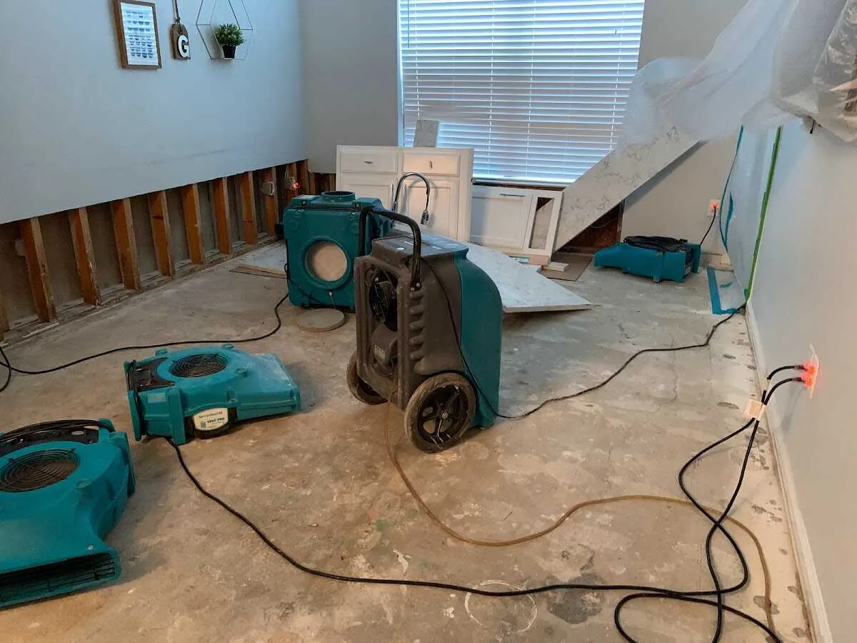 Dehumidifier in flood-cut room for Water Damage Restoration in Benton